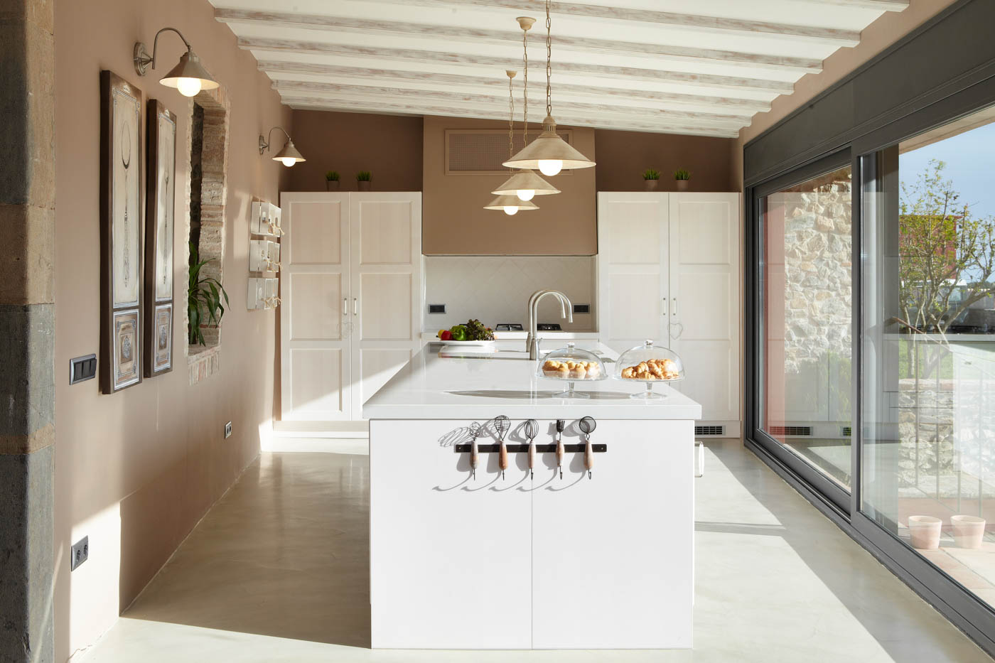 Kitchen opens to large terrace for outdoor meals 